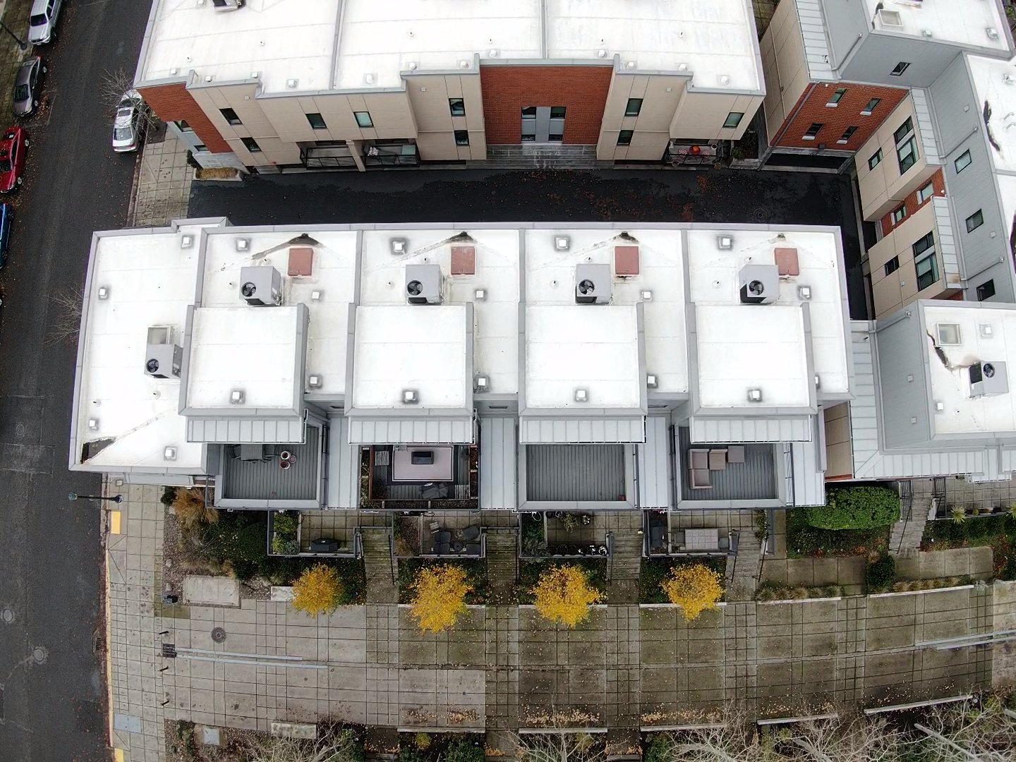 An aerial view of a flat-roofed apartment building