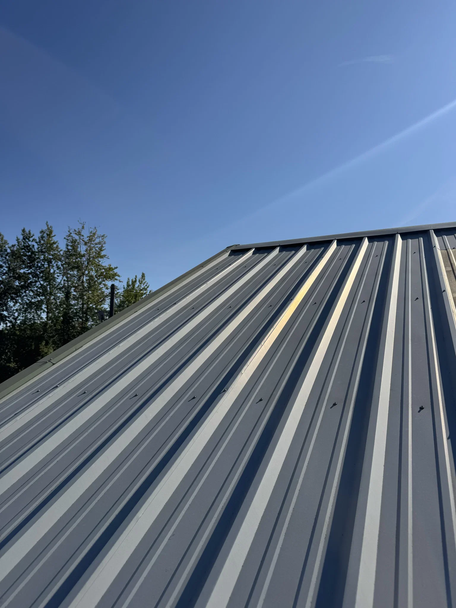 Wear along the ribs of a metal roof.
