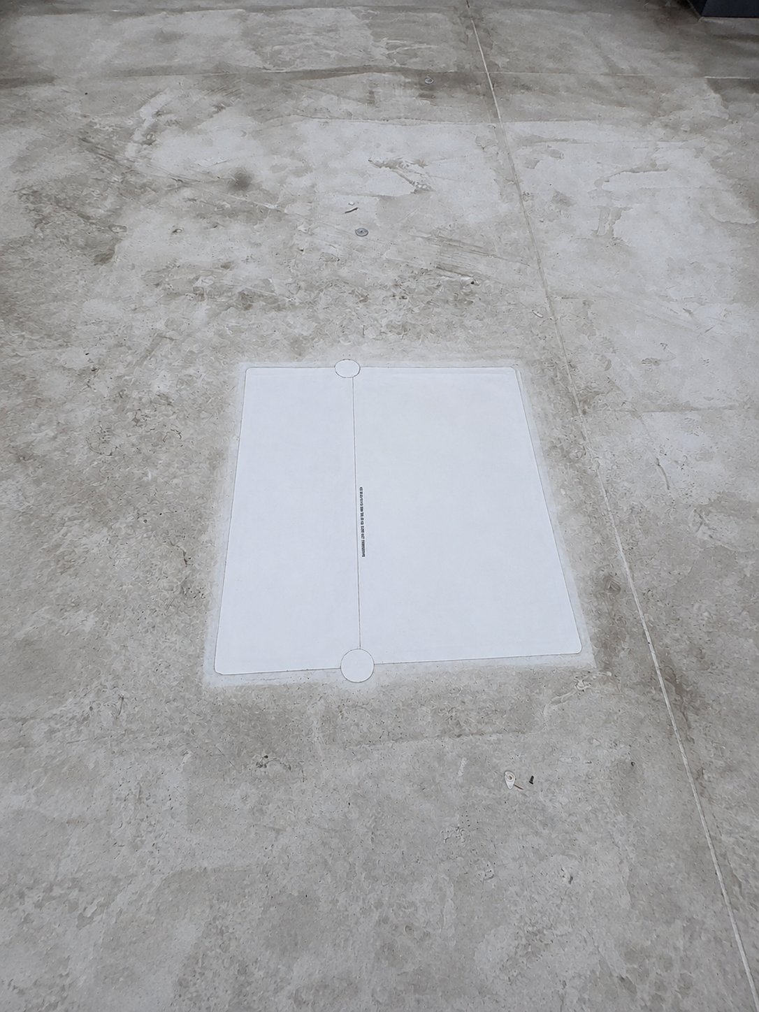 A membrane patch installed over a failing commercial roof seam